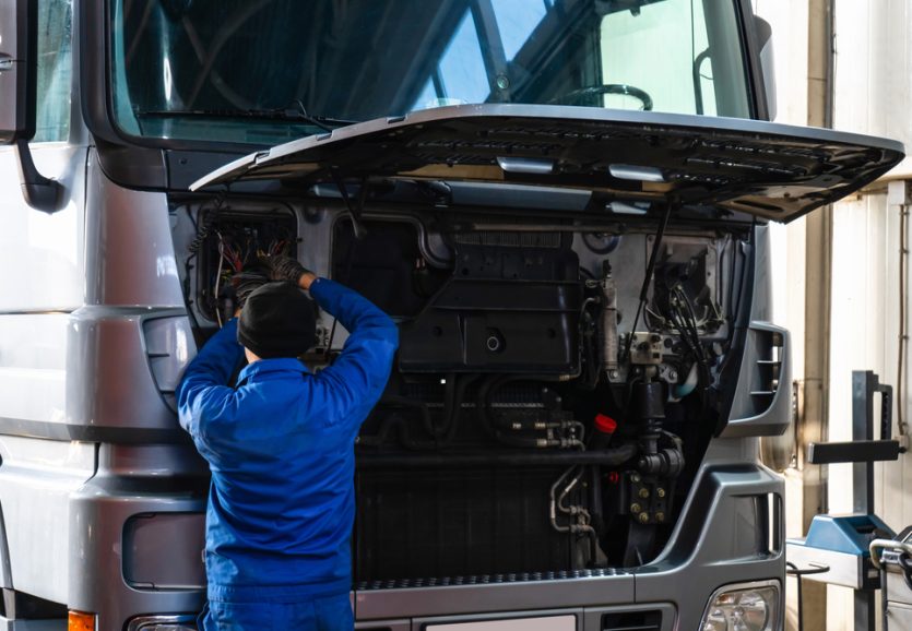 Mechanic,Repairing,The,Truck,In,The,Garage