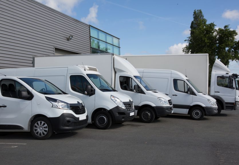 Several,Cars,Vans,And,Trucks,Parked,In,Parking,Lot,For